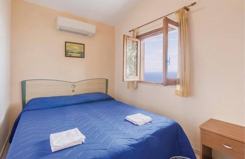 Monte Chiaro Apartment | This modern bungalow belongs to a vacation home complex directly above the sea, with a unique panora