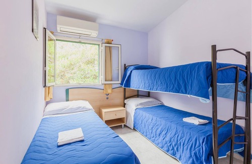 Monte Chiaro Apartment | This modern bungalow belongs to a vacation home complex directly above the sea, with a unique panora