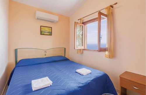 Monte Chiaro Apartment | This modern bungalow belongs to a vacation home complex directly above the sea, with a unique panora