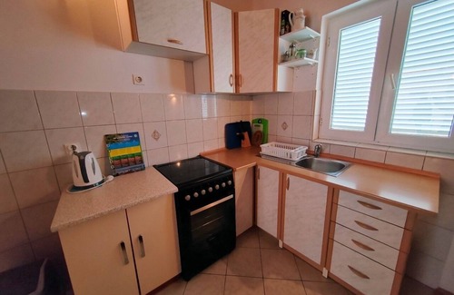 Barbat na Rabu Apartment | Three bedroom apartment with balcony and sea view Barbat, Rab (A-22752-c)