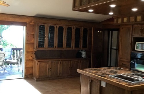 Swift Current House | Three level Log Home on Private 40 Acre Estate.