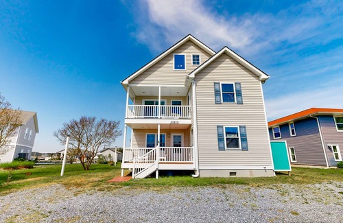 Cedar Neck House | Town of Ocean View canal-front home with dock, kayaks, balconies, grill, & AC