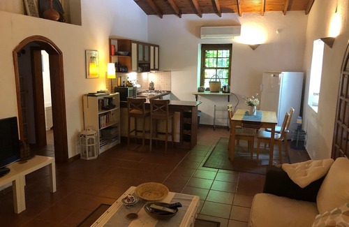 Kayakoy Cottage | Traditional stone cottage with stunning garden in historic Kaya village.