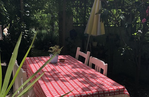 Kayakoy Cottage | Traditional stone cottage with stunning garden in historic Kaya village.