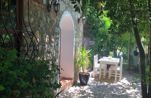 Kayakoy Cottage | Traditional stone cottage with stunning garden in historic Kaya village.
