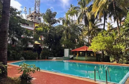 Arpora Apartment | Tropical Charm by Boho- Forest View>Pool & Kitchen