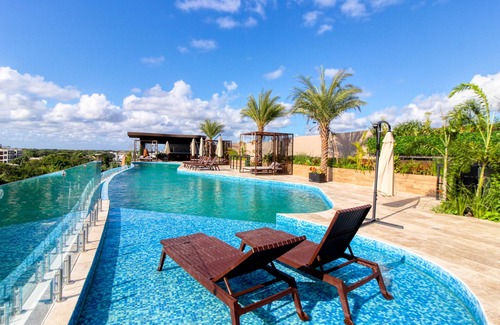 Tulum City Center Apartment | Tropical luxurious apartment with pools, rooftop views, & balcony - dog-friendly