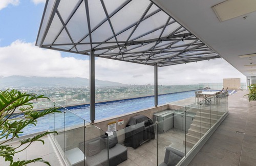 San Pedro Apartment | Tropical Vista iFreses, 2nd floor! AC, TV and Pool