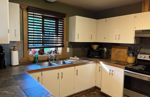 Sooke Cabin | True West Coast experience custom log home with sauna & outside cedar soaker tub