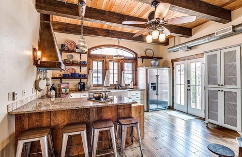 Eufaula Cottage | Tuscan feel with outdoor fireplace and cooking.