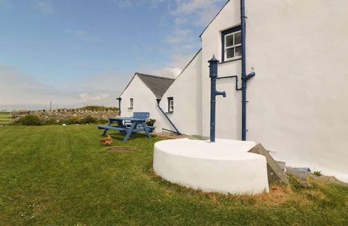 Holyhead Cottage | TY FFERM BODLASAN, family friendly, with open fire in Llanfachraeth