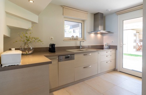 Hersonissos Centre Villa | Unique beachfront location, heated pool with built-in hydromassage, large garden