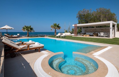 Hersonissos Centre Villa | Unique beachfront location, heated pool with built-in hydromassage, large garden