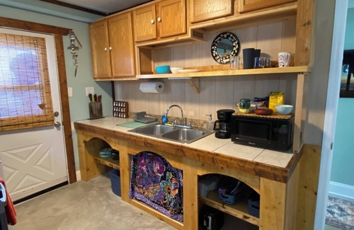 Palm Coast House | Unique stay in the Hammock filled with local art