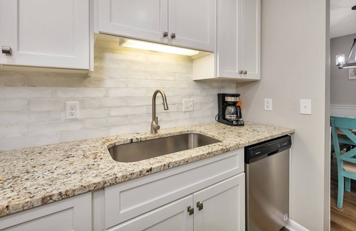 Demere Park Condo | Updated first floor condominium with access to heated pool and tennis courts!