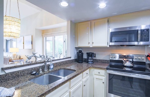South Beach Condo | Updated & Gorgeous End Unit with Spectacular Views of Pool & Sound. South Beach Oasis Awaits you!
