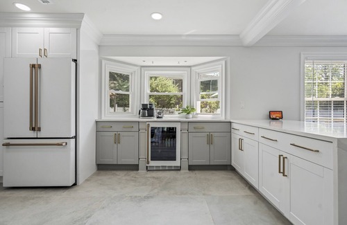 Oakdale House | Updated home with canal & hot tub in backyard. Close to everything!