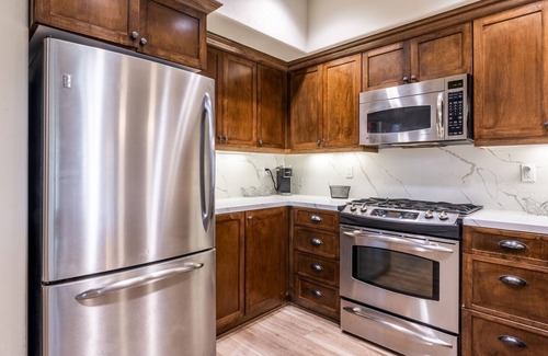 Woodwinds House | Updated Woodwinds Townhome! Walk to the Village! 2 Car Garage! 2 Decks!