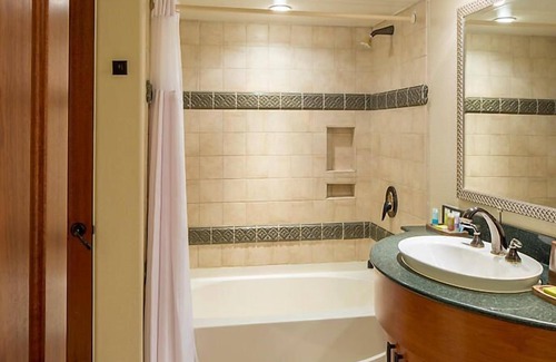 Cibola Vista Resort | UpScale Resort with Outdoor Heated Pool with a waterslide and a poolside bar, tennis court and gym