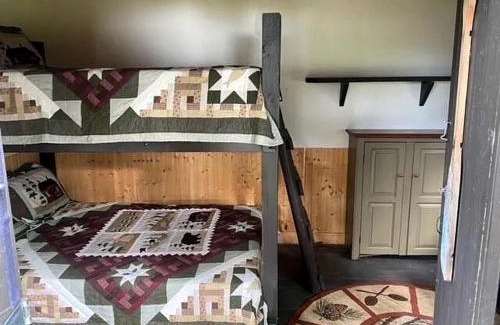 Portage Lake House | Charming Lakeside Cabin Bungalow with Timeless Rustic Beauty near Portage Lake in Maine