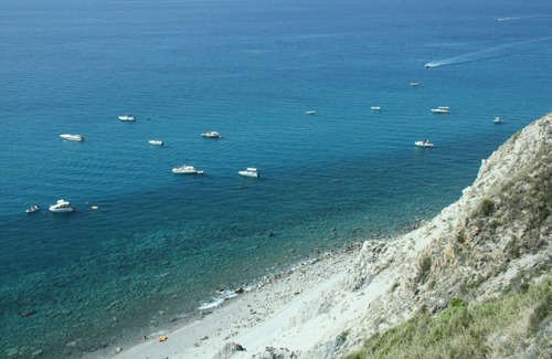 Province of Messina House | Vacation Home "Oasi Azzurra - Bilocale Standard-103" with Shared Pool & 2 Shared Terraces