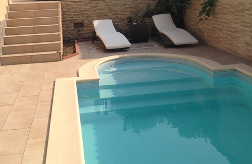 Pogliano Milanese Villa | Villa Le Tre Palme . Suite in relax . immersed in the green garden with swimming pool