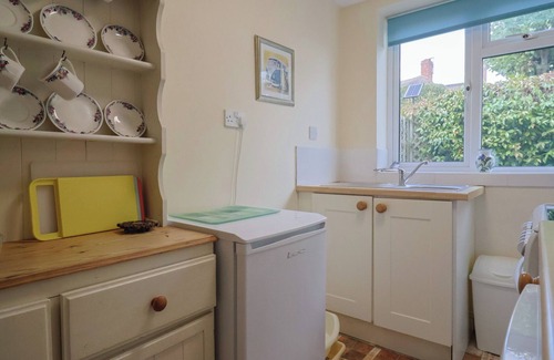 Bridport Cottage | VINE COTTAGE, pet friendly, with a garden in Burton Bradstock
