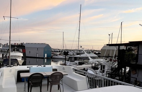 Lower Lonsdale Boat Rental | Vintage Houseboat moored in spectacular Marina nearby Seabus in North Vancouver