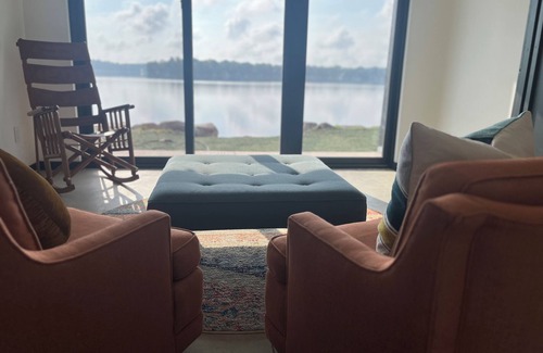 Delton House | Wall Lake Modern Home swimmable beach and paddle boat