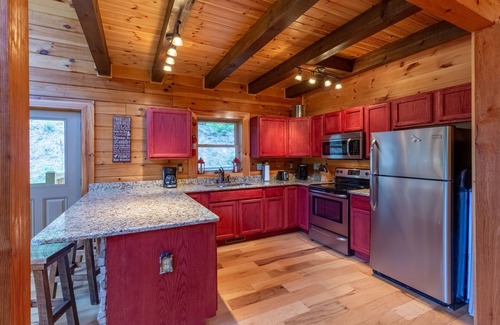Tuckasegee Cabin | Waterfall Hideaway-Spacious Streamside Cabin in Lake Community w/Hot Tub & Kayak!