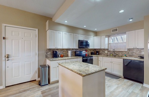 El Lago Condo | Waterfront community condo with on-site pool, water views, & private patio