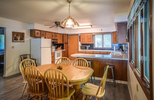 Onekama House | Waterfront home on Portage Lake with lake-view deck & firepit