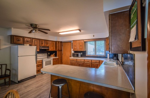 Onekama House | Waterfront home on Portage Lake with lake-view deck & firepit