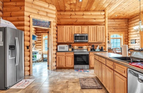 High Point House | Waterfront Log Home, Fire Pit & Table, Swim Spa, & Game Room