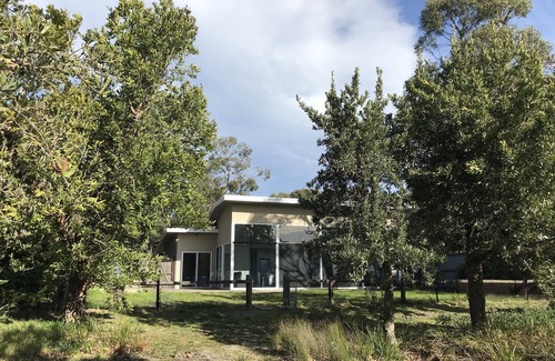 Banksia Peninsula House | Waterfront Property with Private Jetty in Bushland Setting