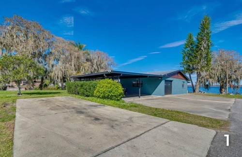 Lake Panasoffkee House | Waterfront property with a private dock & exceptional views of the lake & canal.