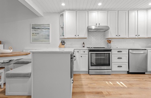 Pine Harbor House | Waterfront views of the beautiful Sapelo river from the living room and porch!