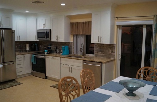 Royal Palm Beach House | Welcome to Lazy Palms! A lake front home in West Palm Beach.