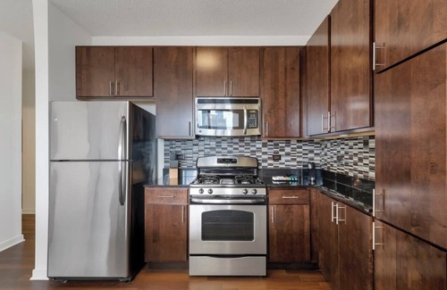 Downtown Chicago Apartment | West Loop Luxe 2BR: Balcony, Skyline Views