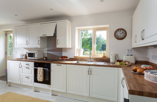 Sibford Gower Cottage | With cosy home comforts in every corner, The Sunset Retreat is the perfect romantic retreat