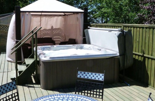 Llandysul House | Wonderful private villa for 4 guests with WIFI, hot tub, TV, patio, panoramic view and parking