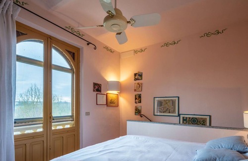 Belveglio House | Wonderful private villa for 3 guests with TV, patio, pets allowed and parking