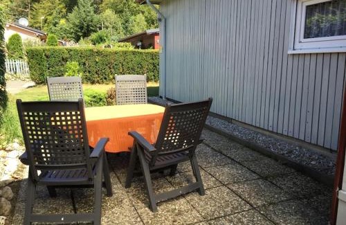 Waldsiedlung Romerstraße House | Wooden holiday home with winter garden