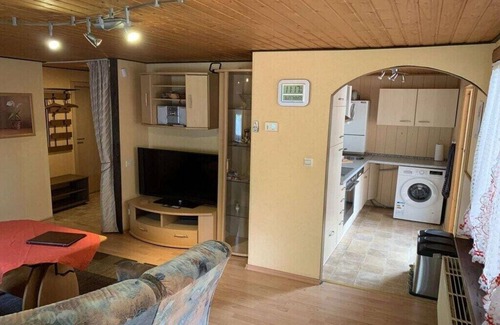 Waldsiedlung Romerstraße House | Wooden holiday home with winter garden