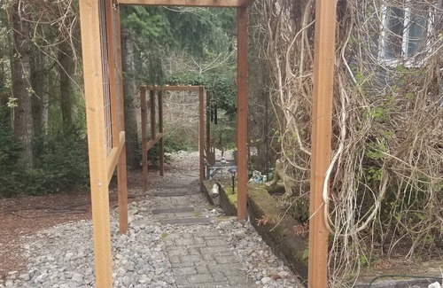Lacey House | Woodsy Retreat has the trail to the temperate rain forest, and outdoor spa.