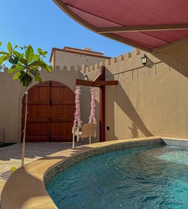 بيت أرض الثراء Rich Land House