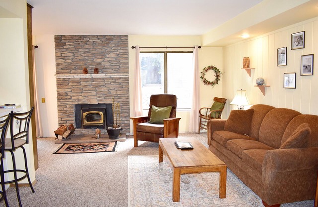 #127 Warm and inviting corner unit across from the shuttle stop and close to the Village