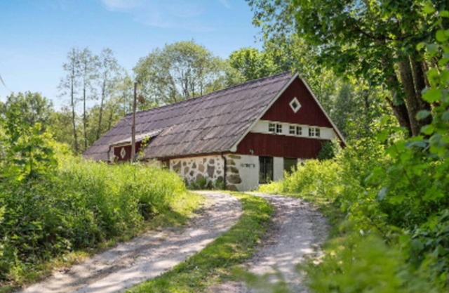 19th century house near the lake in a forest environment