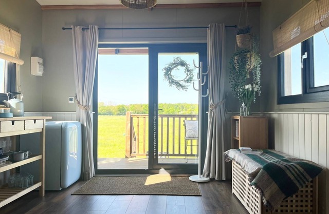 1br-sleeps2-field View-parking-cabin Experience