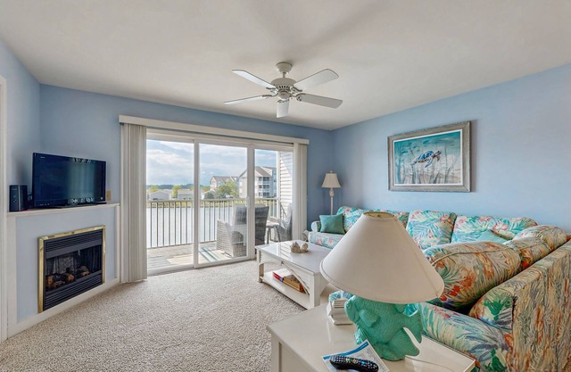 2nd-floor Bethany Bay condo with waterfront views & on-site golf/pool/tennis